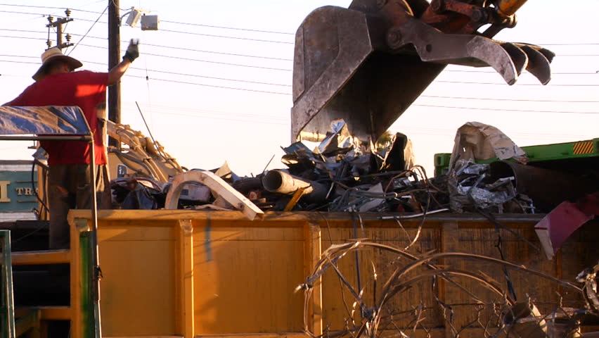 Crane moves scrap metal at a scrap yard in Los Angeles