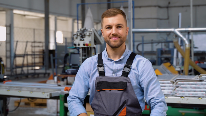 Portrait of manual man worker is standing with confident in uniform at industry factory