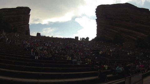 MORRISON, COLORADO CIRCA JUNE 2014. A Time lapse of a crowd gathering to watch concert at Red Rocks venue during sunset. The design of the Amphitheatre consists of two, three hundred-foot monoliths. 