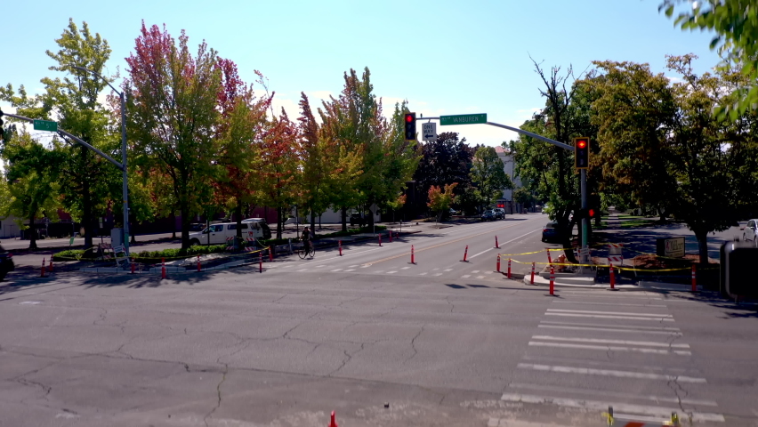 Autumn colors in Corvallis, Oregon. Drone rising in town, revealing old courthouse.