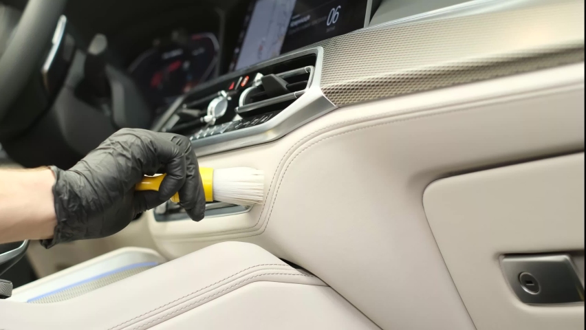 Cleaning the car panel with a brush.  | Shutterstock HD Video #1095759895
