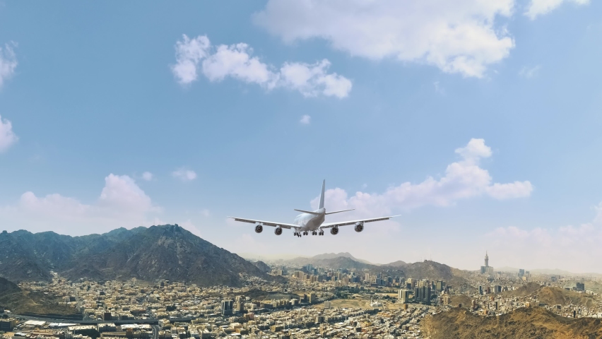 Airliner Flying and Landing Mecca Makkah Saudi Arabia . Airplane concept