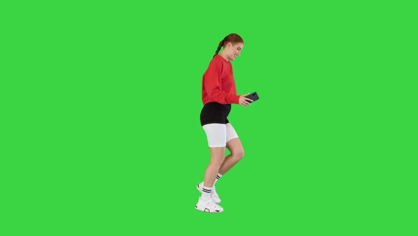 Happy street dancer walks dancing slightly and taking a selfie on a Green Screen, Chroma Key. | Shutterstock HD Video #1095766451