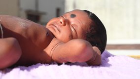 New Born Baby Laying On Direct Sunlight. Sun Exposure in Children Benefits of increased Vitamin D, Serotonin Levels, Insulin Levels, Manages Jaundice, and Higher Energy Levels. - Powered by Shutterstock - Get 15% off with code: PIKWIZARD15