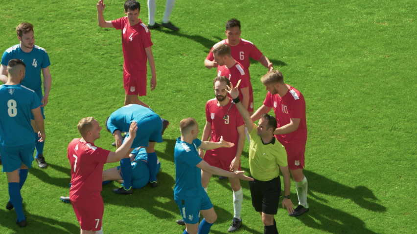 Soccer Football Championship Match: Referee Sees Foul, Gives Signal and Yellow Card, Players Circle him Upset. International Tournament. Sport Broadcast Channel Television Playback. Slow Motion