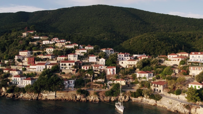 Seaside town in Greece. Aerial view of the seaside town on a sunset.