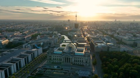 City of Berlin, Germany from above. Aerial cityscape view showing architectural landmarks Reichstag, TV Tower and Berlin Cathedral at sunrise. Drone flight to Alexanderplatz TV Tower, Sunflairs approx Stock Video