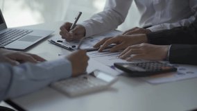 financial analysis business team Young Asian businessman presents sales data to team at work-focused meetings. creative business team sitting together at the office 4k - Powered by Shutterstock - Get 15% off with code: PIKWIZARD15