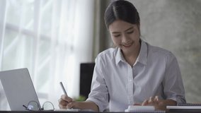 Asian business woman Check business documents, accounting, reports, tax analysis, time, accounting, business data sheets.