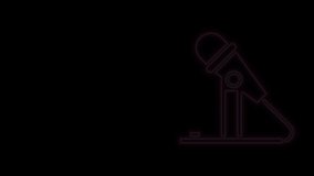 Glowing neon line Microphone icon isolated on black background. On air radio mic microphone. Speaker sign. 4K Video motion graphic animation.