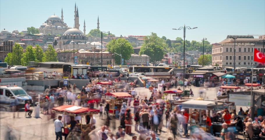 Timelapse motion: Eminonu square at sunny day, Istanbul, Turkey. Crowd of people, sightseeing location, mosques, trading trays, commercial shot, no faces and trading marks