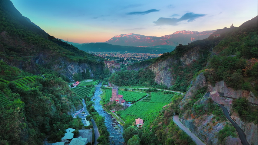Bolzano aerial skyline view, bozen italy city drone video castle old town view.