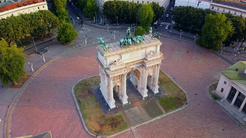 Gate Sempione Porta Sempione city gate to Lombardy in the fall. Arch of Peace. Arco della pace. sunny evening in milan city park aerial panorama 4k italy milano city triumphal arch. Sculptures  Royalty-Free Stock Footage #1095792387