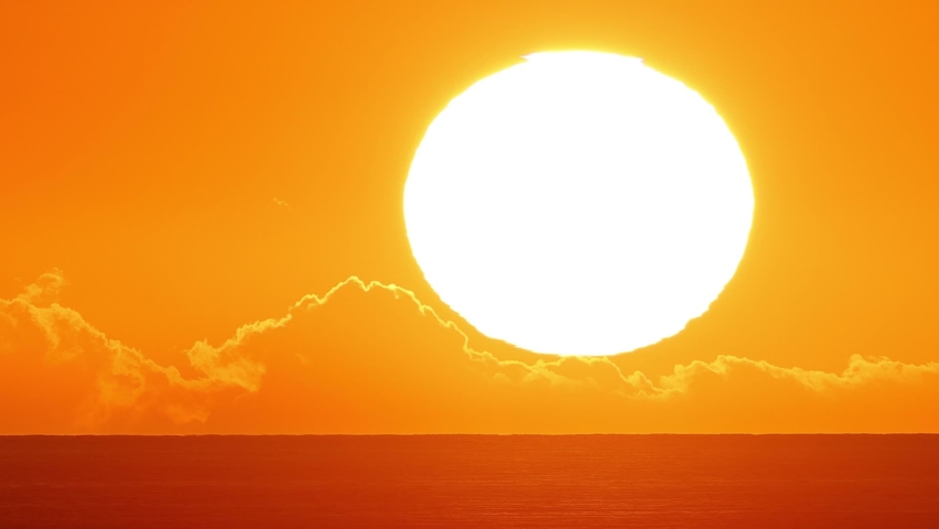 Time lapse of the sun setting over the ocean in Hawaii. Royalty-Free Stock Footage #1095792701