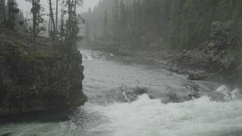 Brink Of The Upper Falls Waterfall View and Yellowstone River at Grand Canyon of the Yellowstone National Park, Wyoming in Morning Fog