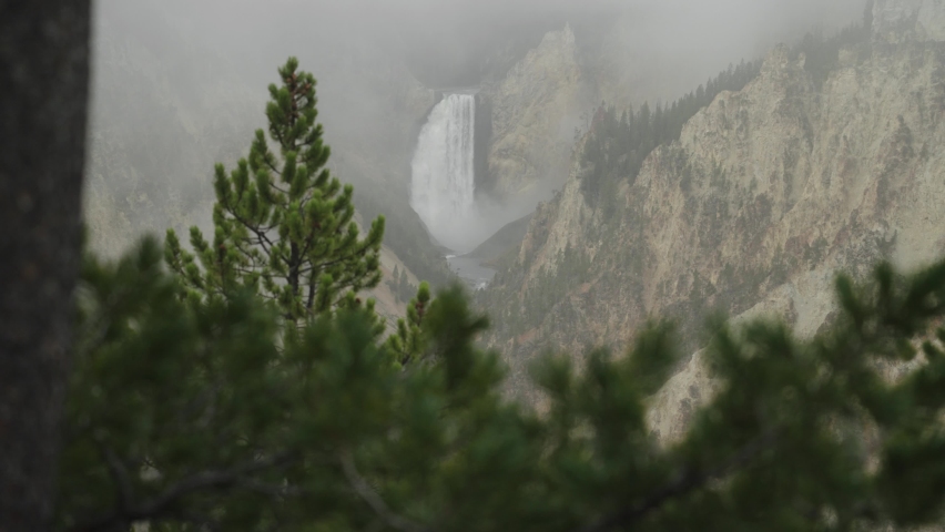 Lower Falls Waterfall and Yellowstone River at Grand Canyon of the Yellowstone National Park, Wyoming in Morning Fog viewed from Artist Point