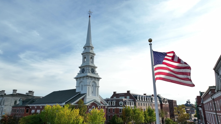 Christian Nationalism theme. USA flag juxtaposed with church steeple. Faith and Christianity, religion theme. Royalty-Free Stock Footage #1095800921