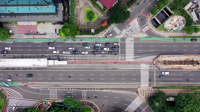 Top down view Sudirman highway with fast traffic in the Central Business Disctrict of Jakarta, Indonesia. Shot in 4k resolution