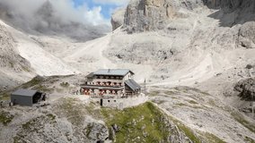 Dolomites, Italy - Mountain Hut Pradidali in Mountain Valley - Drone video 4K 50fps colorgraded