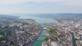 Inscription on video. Zurich, Switzerland. Panorama of the city from the air. View of Zurich Lake. Limmat River Expiry Site. Arises from blue water, Aerial View
