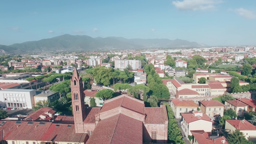 Aerial view of Church and Town in Pisa on a beautiful summer afternoon, Tuscany, Italy. Royalty-Free Stock Footage #1095809667