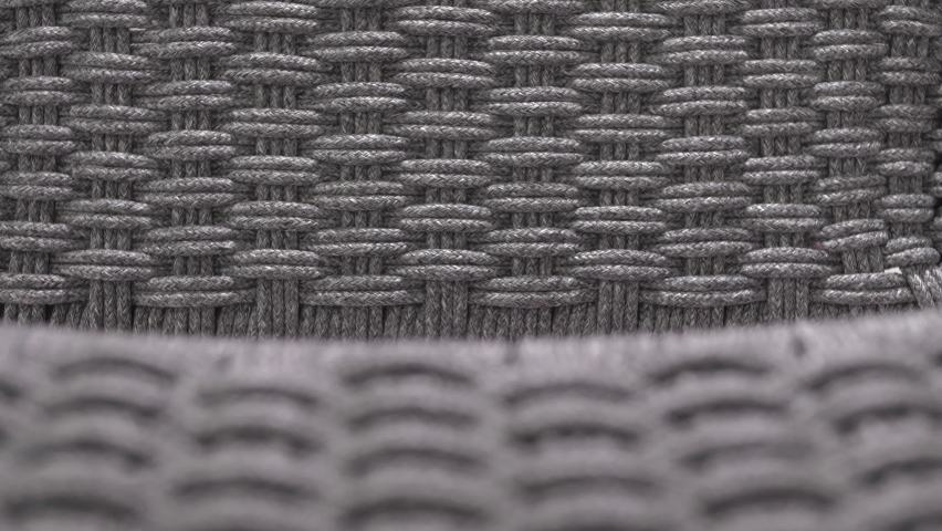 Beautifully woven gray rope frame chair for the yard. Close-up. Macro | Shutterstock HD Video #1095814089