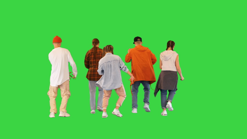 Modern dancing group dancing doing sync moves on a Green Screen, Chroma Key. | Shutterstock HD Video #1095814103