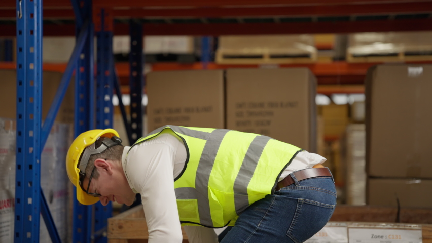 Male warehouse engineer manager suffering from back injury during checking stock working at warehouse factory, Storage worker having back pain at work Royalty-Free Stock Footage #1095814603