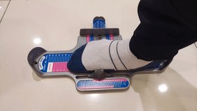 Salesman shoe measures the customer's feet with tool device to get the correct foot size to get the right size shoes. 4K Videos
