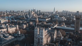 Establishing Aerial View Shot of London UK, United Kingdom, Westminster Abbey and London skyline, slowly moving left