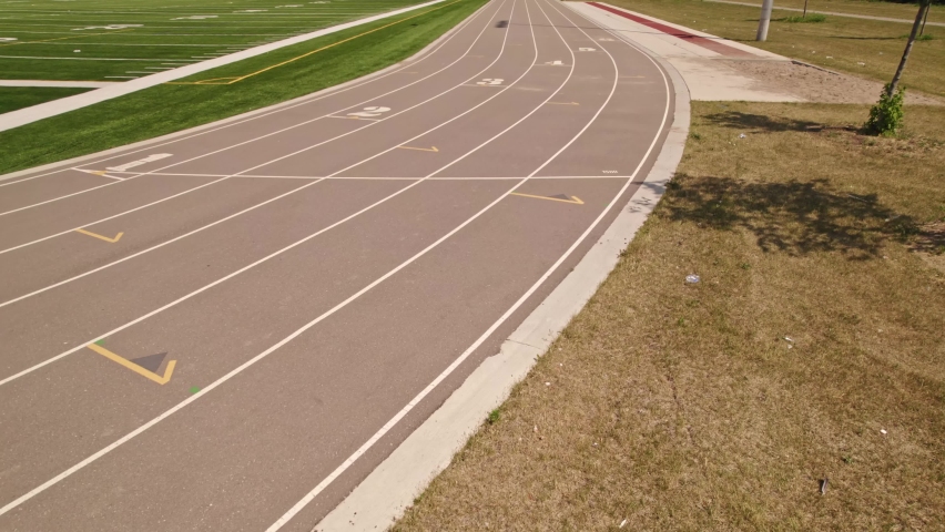 Running track for sport race POV sportsman view. Athletes point of view while training at running track. Aerial view of competing in the race.