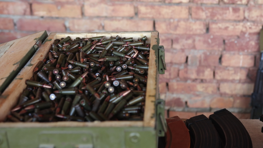 There is a large army box with ammunition for the AK47, military cartridges and ammunition stores.