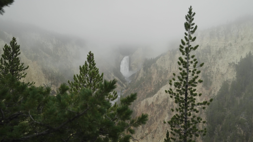 Lower Falls Waterfall and Yellowstone River at Grand Canyon of the Yellowstone National Park, Wyoming in Morning Fog viewed from Artist Point