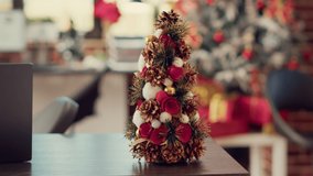 Christmas tree and festive ornaments on office desk used for holiday celebration during winter season. Empty space filled with seasonal decorations for xmas festivity tradition and event. Close up. - Powered by Shutterstock - Get 15% off with code: PIKWIZARD15