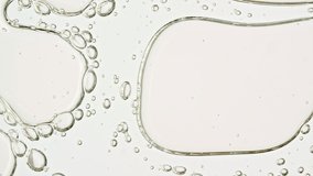 Transparent cosmetic gel fluid with molecule bubbles oil distribution on a white background. Macro Shot of Natural Organic Cosmetics, Medicine. Production Close-up. Slow Motion - Powered by Shutterstock - Get 15% off with code: PIKWIZARD15