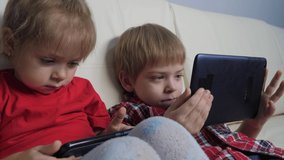 happy family teamwork kids watch online streaming video lifestyle on a smartphone. little boy and girl brother sister children watch online streaming broadcasting cartoons on the phone - Powered by Shutterstock - Get 15% off with code: PIKWIZARD15