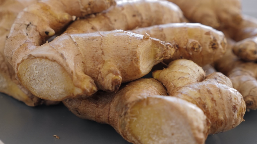 Natural immunity boosters - roots of ginger, alternative medicine concept. Rotating