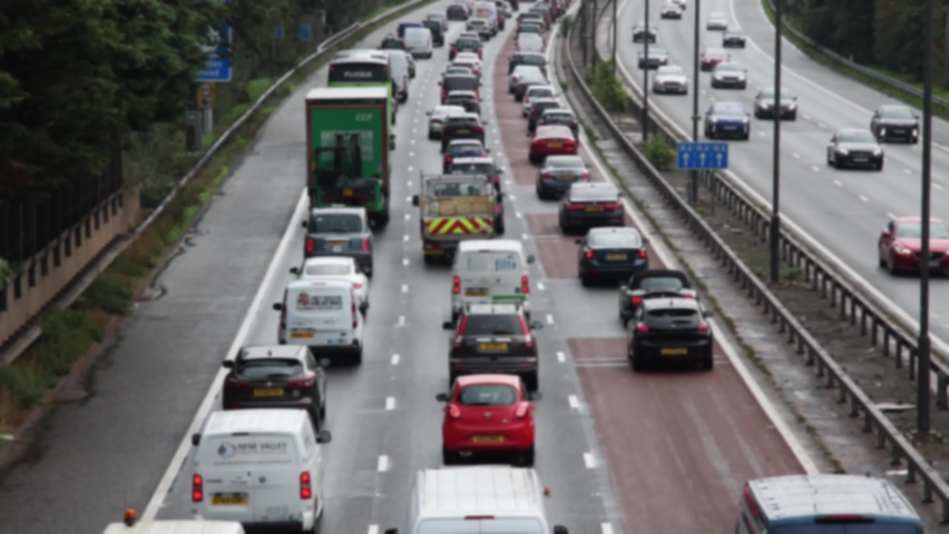 Heavy, slow moving morning rush hour motorway traffic. Blurred, real time.	 Royalty-Free Stock Footage #1095870033