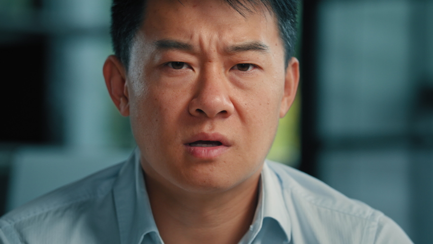 Portrait of angry strict asian chinese man expressing annoyance dissatisfaction male annoyed japanese korean businessman complaint business problem displeasure rage emotion furious negative attitude Royalty-Free Stock Footage #1095873771
