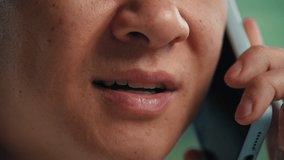 Close up Asian Korean male Japanese businessman professional worker consultant man talk phone speak remote wireless consultation distance mobile conversation indoors negotiate with business partners - Powered by Shutterstock - Get 15% off with code: PIKWIZARD15