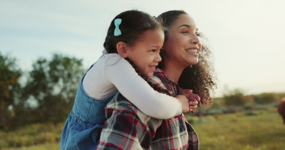 Love, happy mom and child piggyback smile with happiness on rural organic agriculture farm in the countryside at sunset. Black mother, young child and spend quality time together in nature in Kansas Royalty-Free Stock Footage #1095880453