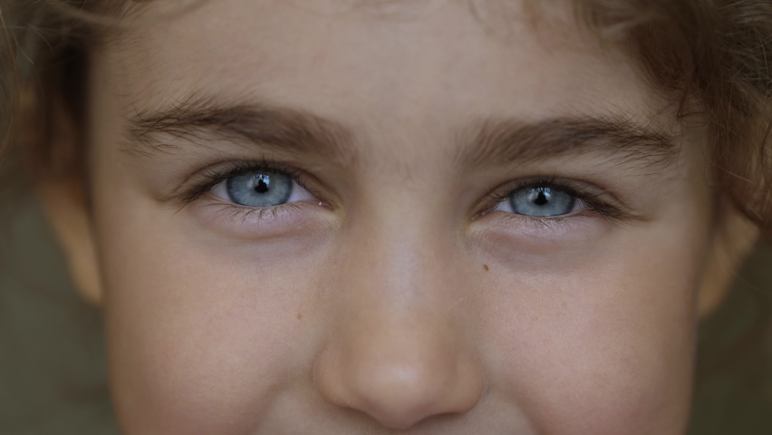 Attractive Enthusiastic Eyes Child. Child's eyes close-up. Little Girl Looking Into camera. Inquisitive Little Kid Girl Portrait. Face Funny Contemplative Kid. Laughs Happily Teenager Girl Looking. Royalty-Free Stock Footage #1095887295