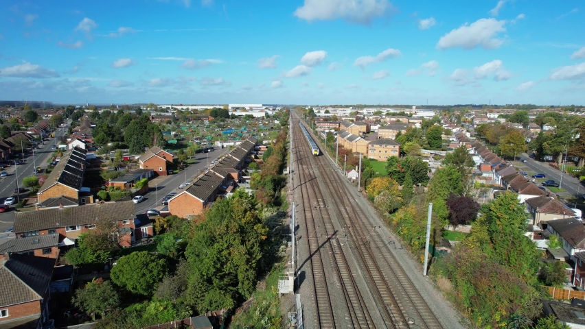 High Angle Footage of Train on Tracks, which is passing through Luton City of England UK