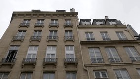 Facade of a typical French palace. City of Paris. Tilt 4K