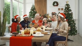 A group of multi ethnic. Portrait of Caucasian and African American black woman have a celebration dinner taking a selfie in party on Merry Christmas Eve Xmas on holiday at home. People lifestyle. - Powered by Shutterstock - Get 15% off with code: PIKWIZARD15
