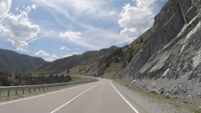 Video of driving in a car In summer season along the mountain road in Altai. Siberia, Russia
