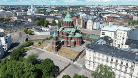 Aerial view of Uspenski Cathedral, the main cathedral of the Orthodox Church of Finland. Helsinki city skyline.