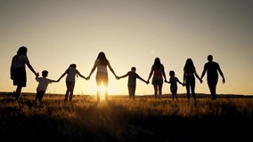 Big happy family. Group of people have fun walking in the park on green grass. Parents and children walk together holding hands at sunset. Family love and support. Family teamwork in park on vacation - Powered by Shutterstock - Get 15% off with code: PIKWIZARD15