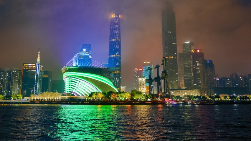China, Shanghai Bund at night. Night lights illumination, moving boats and colorfull reflection in the river time lapse
