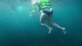People tourists snorkel in the sea, underwater shooting. Tourism and travel concept